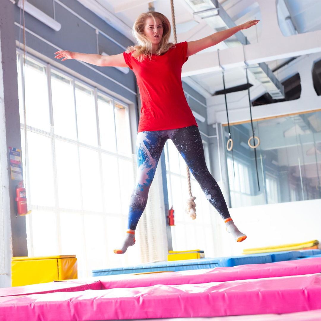 Women Jumping on trampoline In a trampoline Park - Akrobat UK